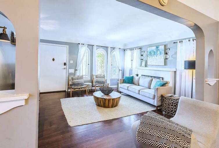 Step into this bright and inviting living room, filled with natural light and cozy seating, perfect for relaxing after a day of exploring. Step into this bright and inviting living room, filled with natural light and cozy seating, perfect for relaxing after a day of exploring.